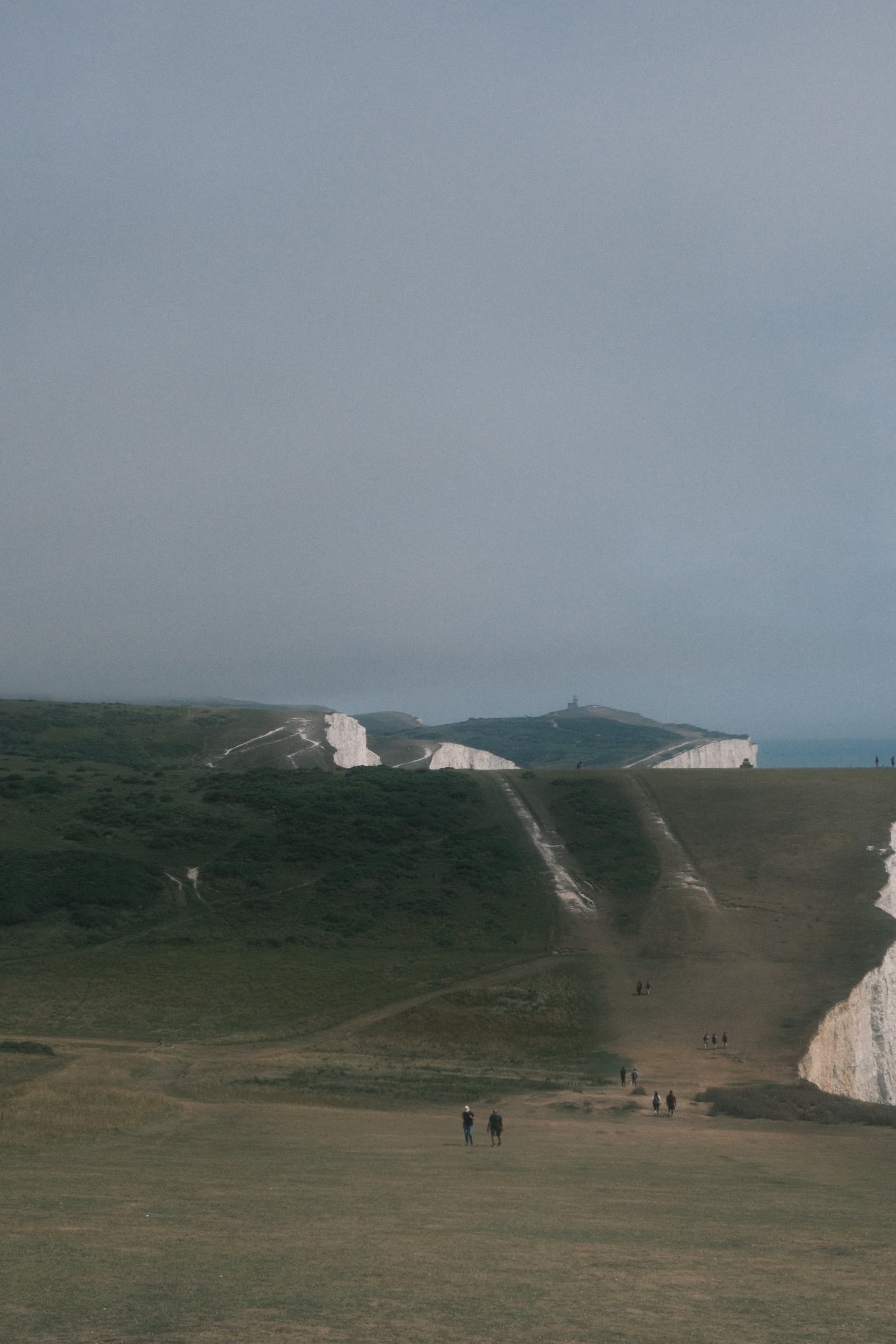Seven Sisters cliffs with walkers in the distance
